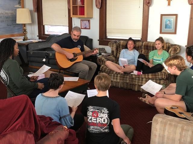 Urbana High School history teacher Mark Foley with Uni students