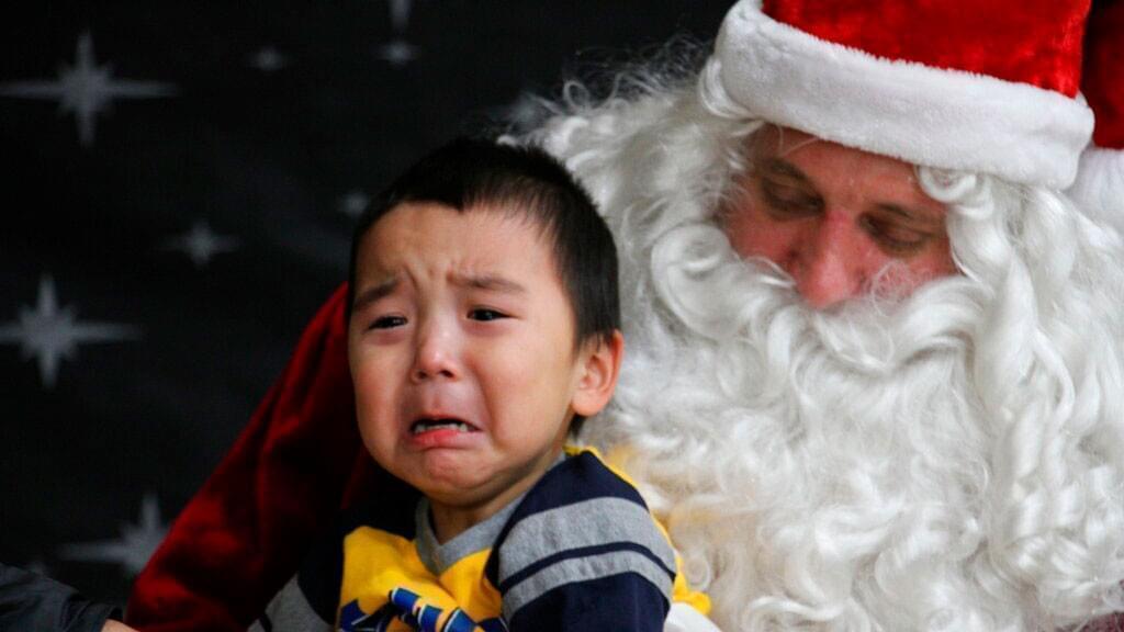 This Dec. 3, 2019, photo shows Adam Black having his photo taken with Santa Claus in Napakiak, Alaska.