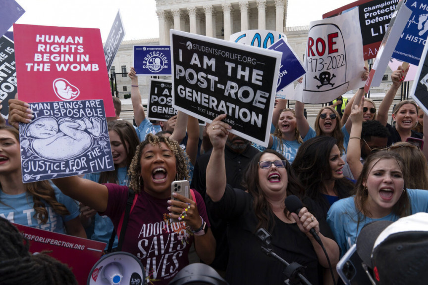 Anti-abortion rights protesters celebrate after the news of Supreme Court overturned Roe vs Wade elimination the constitutional right to abortion, gather outside the Supreme Court in Washington, Friday, June 24, 2022. The Supreme Court has ended constitutional protections for abortion that had been in place nearly 50 years, a decision by its conservative majority to overturn the court's landmark abortion cases.