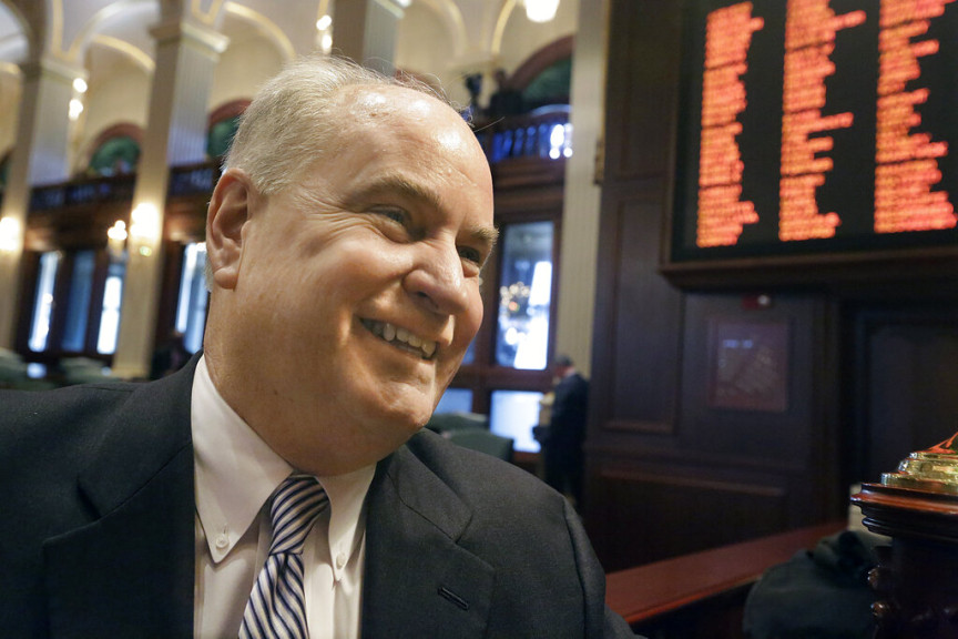 In this Wednesday, Jan. 28, 2015 photo, Illinois Rep. Dan Brady, R-Normal, speaks with reporters while on the House floor during session at the Illinois State Capitol in Springfield.