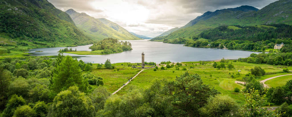 Glenfinnan Monument on Loch Shiellverness surrounded by green hills