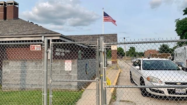 Crime scene tape is visible at the American Legion post in north Champaign after a shooting during the afternoon of July 2, 2021.