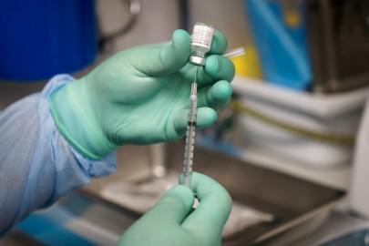 In this Thursday, Aug. 26, 2021 file photo, a syringe is prepared with the Pfizer COVID-19 vaccine at a mobile vaccine clinic in Santa Ana, Calif. New U.S. studies released on Friday, Sept. 10, 2021 show COVID-19 vaccines remain highly effective, especially against hospitalizations and death, even against the extra-contagious delta variant.