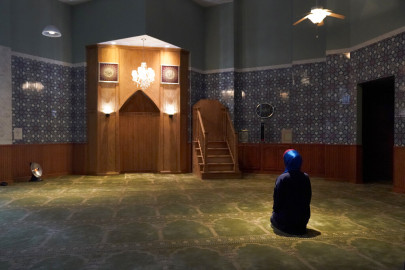 Madinah Javed sits in a prayer room at the American Islamic College for her afternoon prayer Thursday, Jan. 27, 2022, in Chicago. 