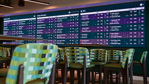 Screens display betting information inside Caesars Sportsbook inside Rocket Mortgage FieldHouse in Cleveland.