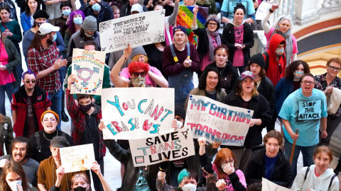 Trans-rights activists protest outside the House chamber at the state Capitol before the State of the State address on Feb. 6 in Oklahoma City.