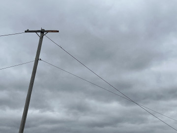 Storm clouds forming above a Power line in Illinois. 