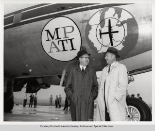 Two men stand in front of MPATI