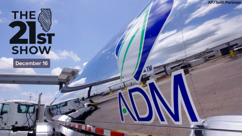 the mirror finish on an ADM tanker truck reflects blue sky and clouds