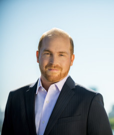 headshot of man in sports coat